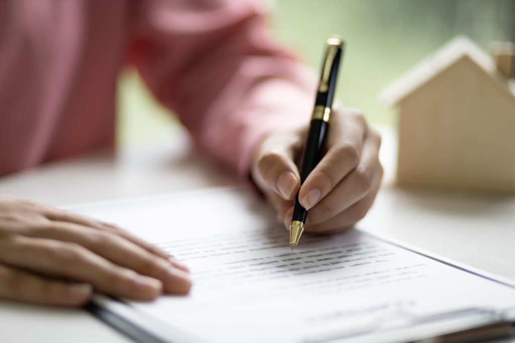 Signing of a real estate contract. Home Insurance and Real Estate